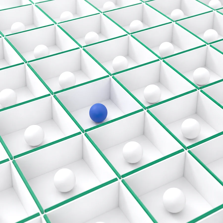 A grid of sealed white cells divided by green walls, each holding one contained sphere.
